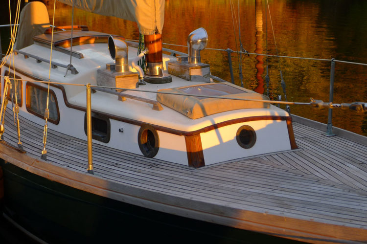 a forward deadlight, two forward round opening portlights, and two rectangular opening portlights